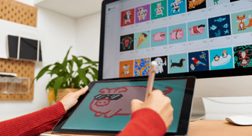 A person creates digital art on a tablet. 