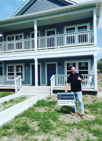 Alex Robertson, Territory Manager for hard money lender Fund That Flip, in front of a multi-unit property financed by us.
